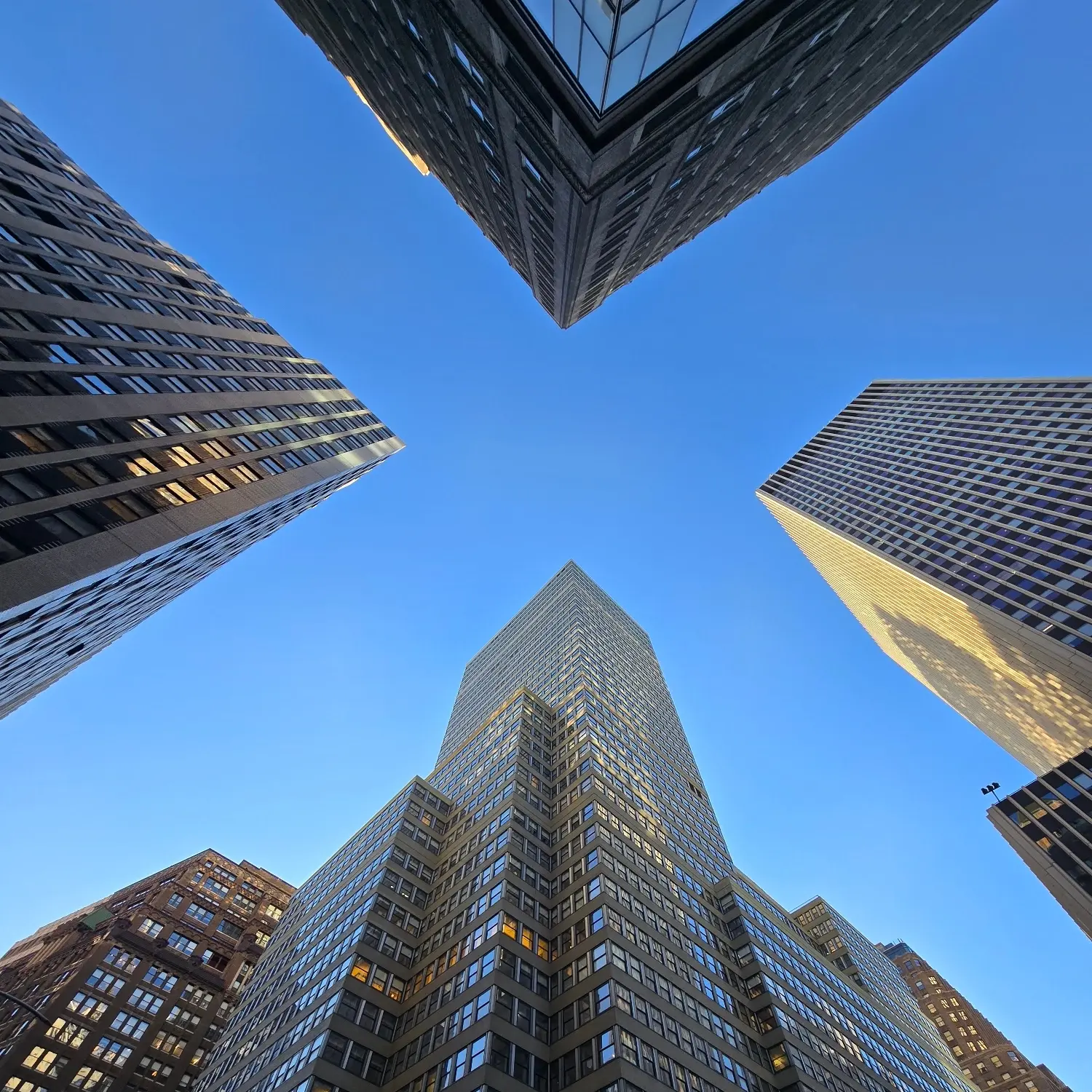 Skyscrapers from below against blue sky